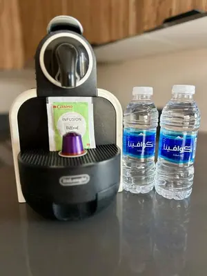 two bottles of water in a blender on a counter at The Hidden Secret in Casablanca