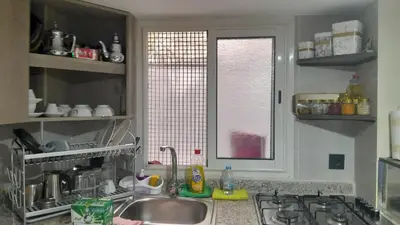 a kitchen with a sink and a window at Studio sympa in Casablanca