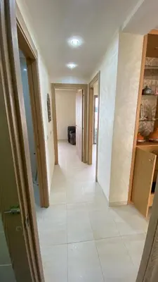 a hallway of a house with a tile floor at Puerto Banus in Mansouria