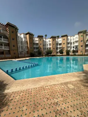 a large swimming pool in front of some buildings at Casa Amy in Mohammedia