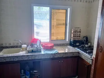a kitchen counter with a sink and a window at Appartement en bord de mer à Harhoura in Temara