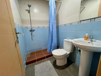 a bathroom with a toilet and a sink at Casablanca Central Suites - Casa Voyageurs in Casablanca