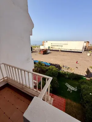 a balcony of a building with a view of a parking lot at Luxury Apartment Ocean View and Private Beach Ain Diab in Casablanca