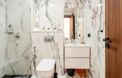 a bathroom with a toilet and a sink and a shower at Studio vert chic au cœur de Casablanca in Casablanca