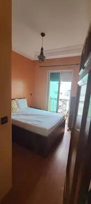 a bedroom with a bed in a room with a window at 2 bedrooms apt Ricoflores Mimosa in Mohammedia