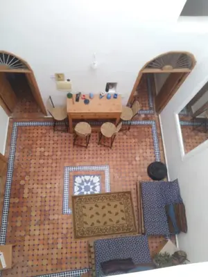 an overhead view of a living room with a table and chairs at Studio with Swimmingpool in Harhoura in Temara