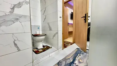 a bathroom with a toilet in a room at 1min walk B&B City Center in Casablanca