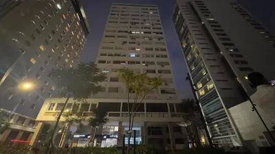 two tall buildings in a city at night at 1min walk B&B City Center in Casablanca