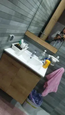 a bathroom with a white sink and a mirror at Mansouria in Mohammedia
