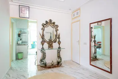 a room with a mirror on the wall at Coastal Moroccan Retreat with Ocean Views in Rabat