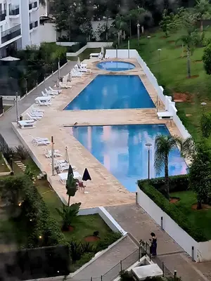 an overhead view of the pool at Elegant & Spacious Apartment in Prestigia in Rabat