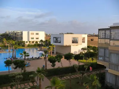 an aerial view of a resort with a pool and buildings at Les Sables de Sidi Rahal - Blue Beach in Sidi Rahal