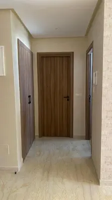 a hallway with two doors in a room at Studio calme à Zenata in Aïn Harrouda
