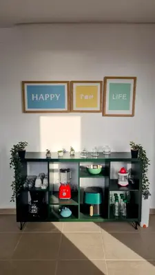 a toy kitchen with a shelf with a happy life sign at Superbe duplex avec vue mer in Aïn Harrouda