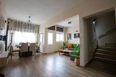 a living room with a table and a dining room at Duplex au centre de Rabat in Rabat