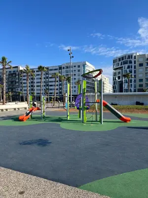 a playground with a bunch of playground equipment at Appartement élégant avec vue imprenable sur la corniche de Casablanca in Casablanca