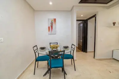 a dining room with a table and chairs at Mamounia Horizon in Casablanca