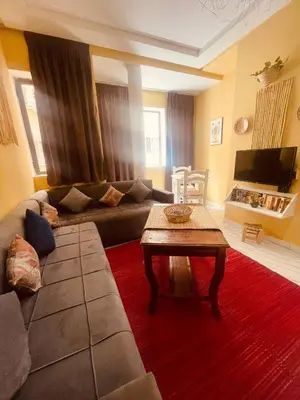 a living room with a couch and a table at Sduisant Studio in Casablanca in Casablanca
