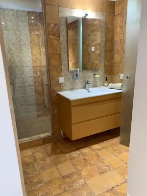 a bathroom with a sink and a shower at Villa oasis sidi rahal in Casablanca