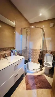 a bathroom with a shower and a toilet and a sink at CASABAY KETTANI SIDI Rahal in Sidi Rahal