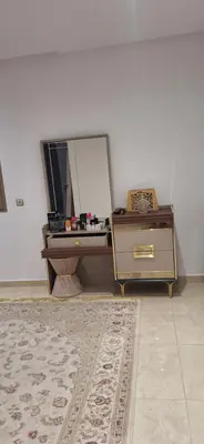 a dressing room with a mirror and a dresser at Étage d'une prestigieuse villa in Rabat