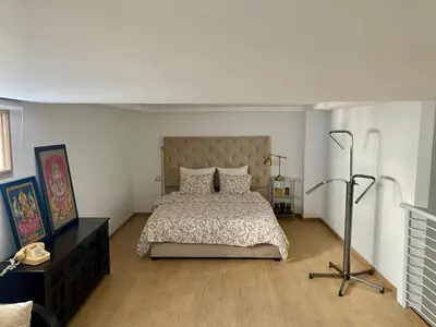 a bedroom with a bed and a lamp in it at Le LOFT in Casablanca
