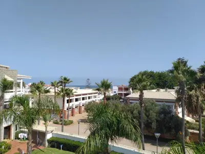 an aerial view of a resort with palm trees at Skhirat Beach Appartement in Skhirat
