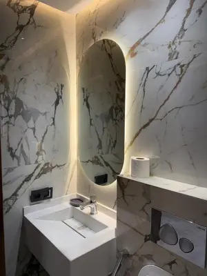 a bathroom with a white sink and a mirror at Stylish Apartment with a seaview 9 in Casablanca