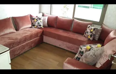 a brown leather couch in a living room at Blue Beach sidi rahal in Sidi Rahal