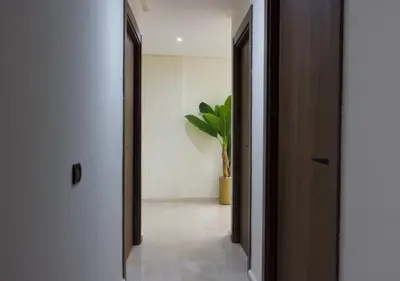 a hallway with two doors and a potted plant at R102-3-4 Amazing apartments in Belvedere with Breathtaking Ocean and Street Views in Casablanca