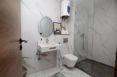 a bathroom with a sink and a toilet and a shower at Private terrasse and spa Studio Sahara in Casablanca in Casablanca