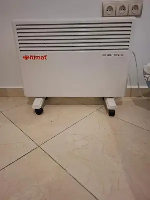 a white radiator sitting on a tile floor at Apt 3 ch Casablanca 3 min Casa Voyageurs idéal pour une famille in Casablanca