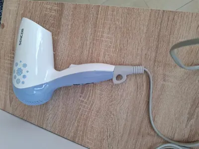 a electric hair dryer sitting on top of a table at Apt 3 ch Casablanca 3 min Casa Voyageurs idéal pour une famille in Casablanca