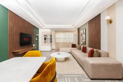 a living room with a couch and a table at 3BR Modern Stay in Heart of Rabat in Rabat