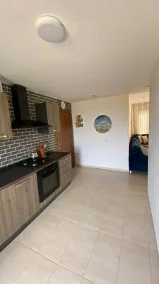 a room with a kitchen with a counter top at Puerto banus appartement in Mohammedia