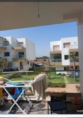 a view of a apartment complex from a balcony at Blue beach in Sidi Rahal