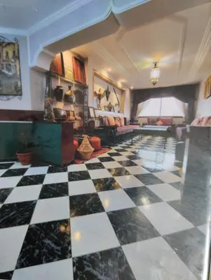 a lobby with a checkered floor in a room at Spacious with Great Location in Casablanca