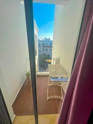 a balcony with a table and a view of a balcony at DarBouazza SurfHouse Sea View in Tamaris