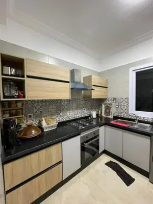 a kitchen with a stove and a counter top at ossama in Mansouria