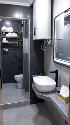 a bathroom with a white sink and a toilet at Studio Tetouan in Deroua