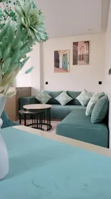 a living room with a couch and a table at Studio Tetouan in Deroua