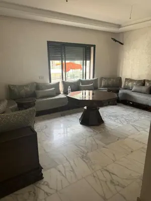 a living room with couches and a coffee table at Ocean Park Apartment for rent in Casablanca