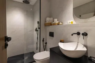 a bathroom with a sink and a toilet and a shower at Small nest in a good location, quiet in Casablanca