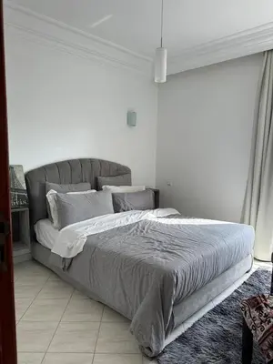 a bedroom with a large bed in a white room at Apartment in Casablanca Maarif in Casablanca