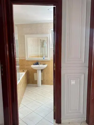 a bathroom with a sink and a bath tub and a sinkessment at Apartment in Casablanca Maarif in Casablanca