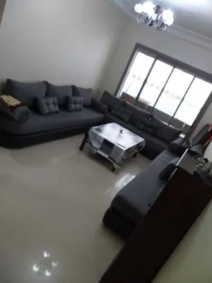 a living room with a couch and a coffee table at Blanca beach in Casablanca