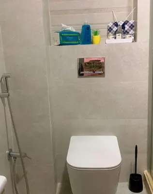 a bathroom with a white toilet and a shower at Dar Bouazza Plage in Dar Bouazza