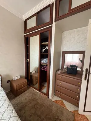 a bedroom with a bed and a dresser and a mirror at 2 Bedroom APT Near downtown - Perfect Location in Casablanca