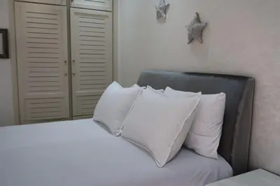 a bedroom with a bed with white pillows at MTL 33 Casablanca city center in Casablanca