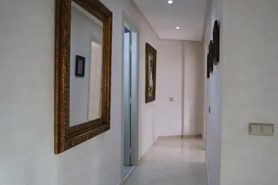 a hallway with a mirror on the wall and a hallway with at MTL 33 Casablanca city center in Casablanca